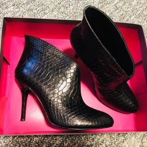Vince Camuto snake print leather booties.